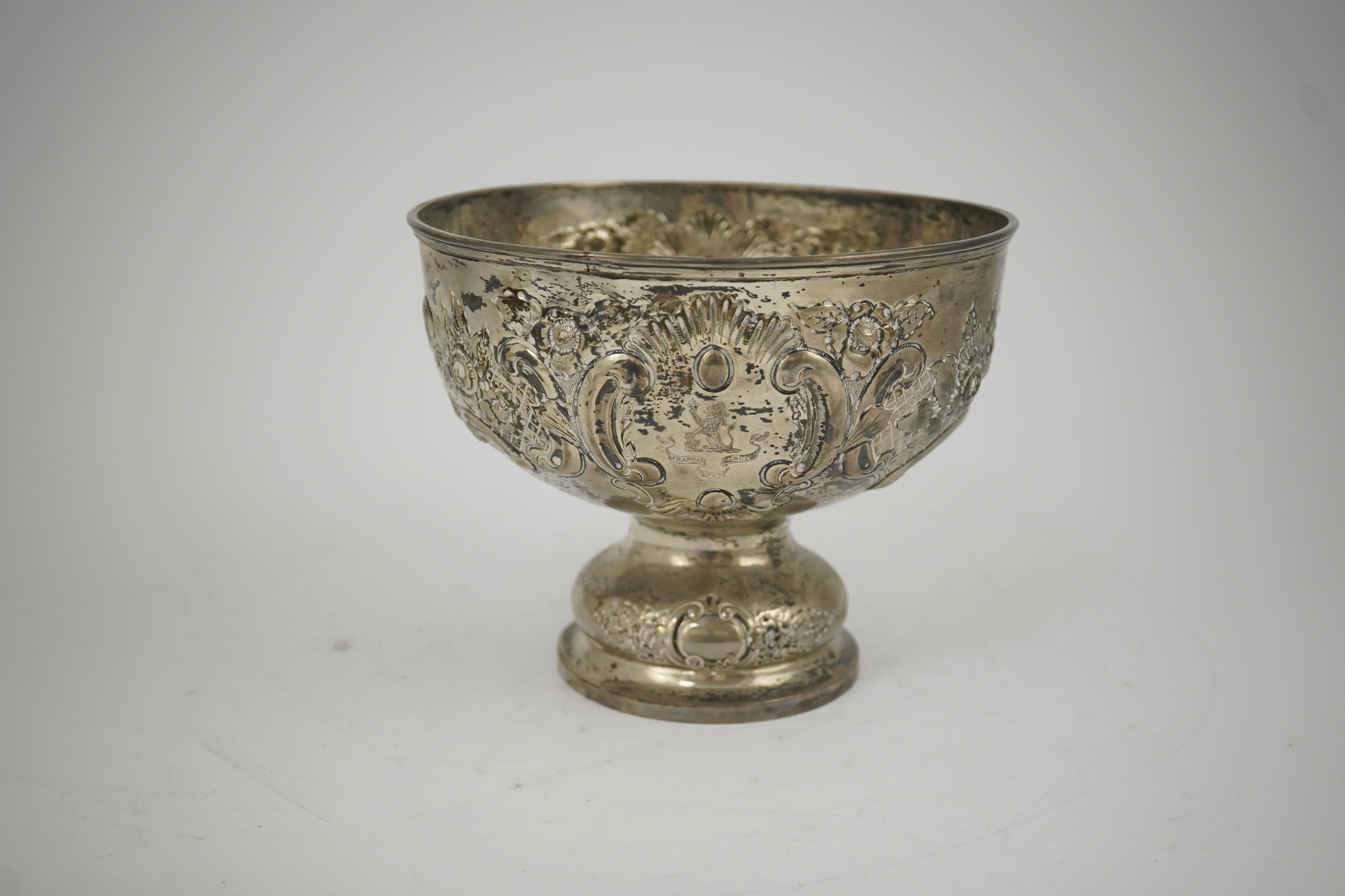 A George V repousse silver pedestal rose bowl, by Carrington & Co